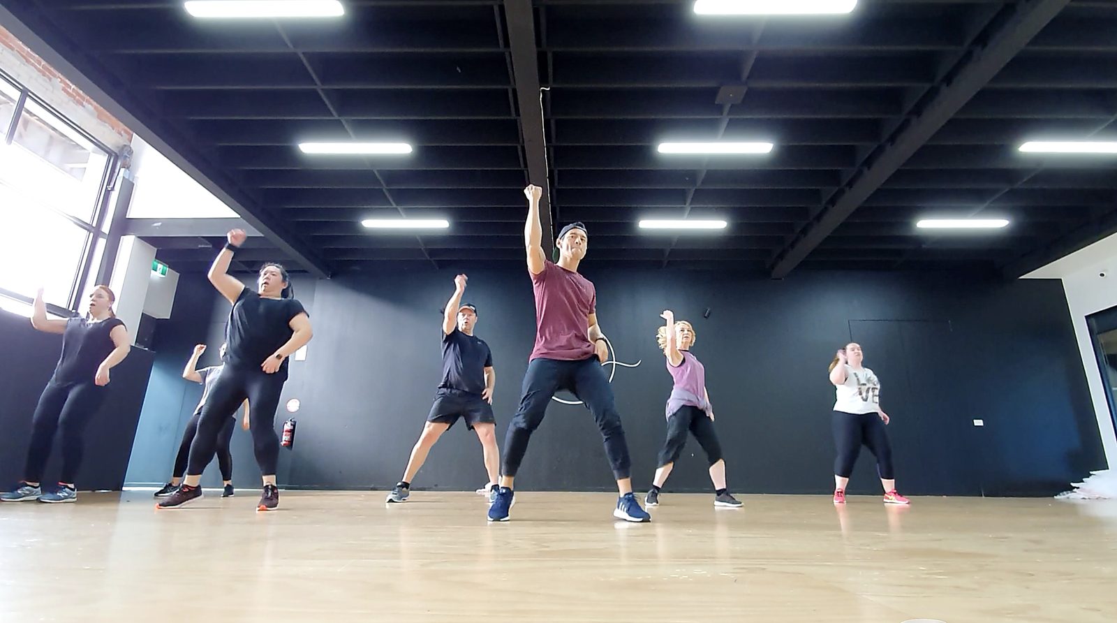 A corporate team dancing together during a Floor Session